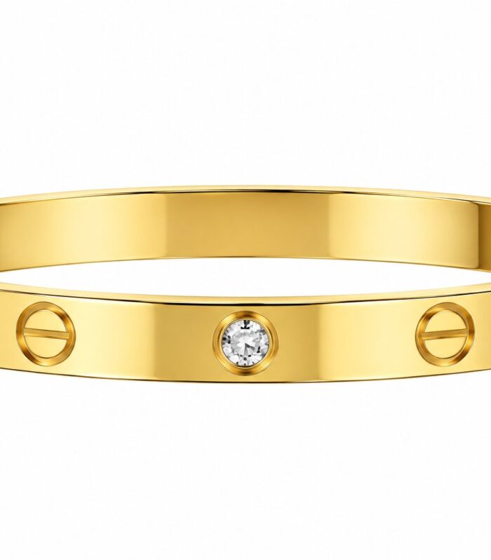 Gold-tone screw-motif bangle with clear faceted crystal-style accents, front view